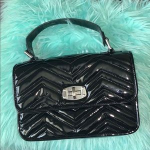 Never been worn Black latex purse from forever 21